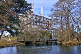 The former power plant towers over the millrace using the energy of Comal Springs water