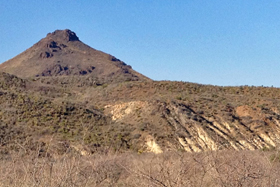 White Upper Cretaceous limestone and marl, and Little Aguja Peak intrusion, as seen from Boy Scout Road