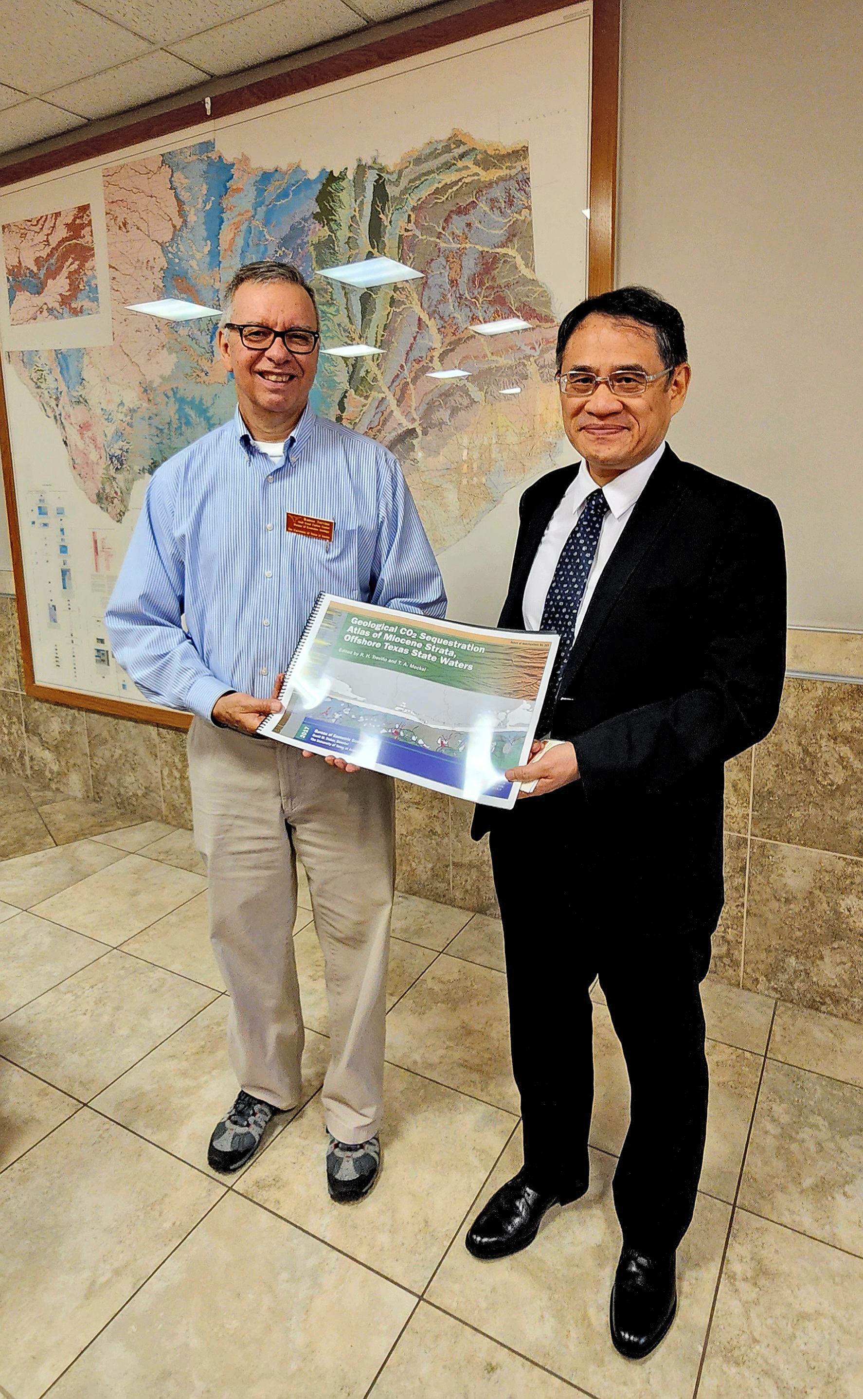 Ramon Trevino presenting gift to Taiwan visitor