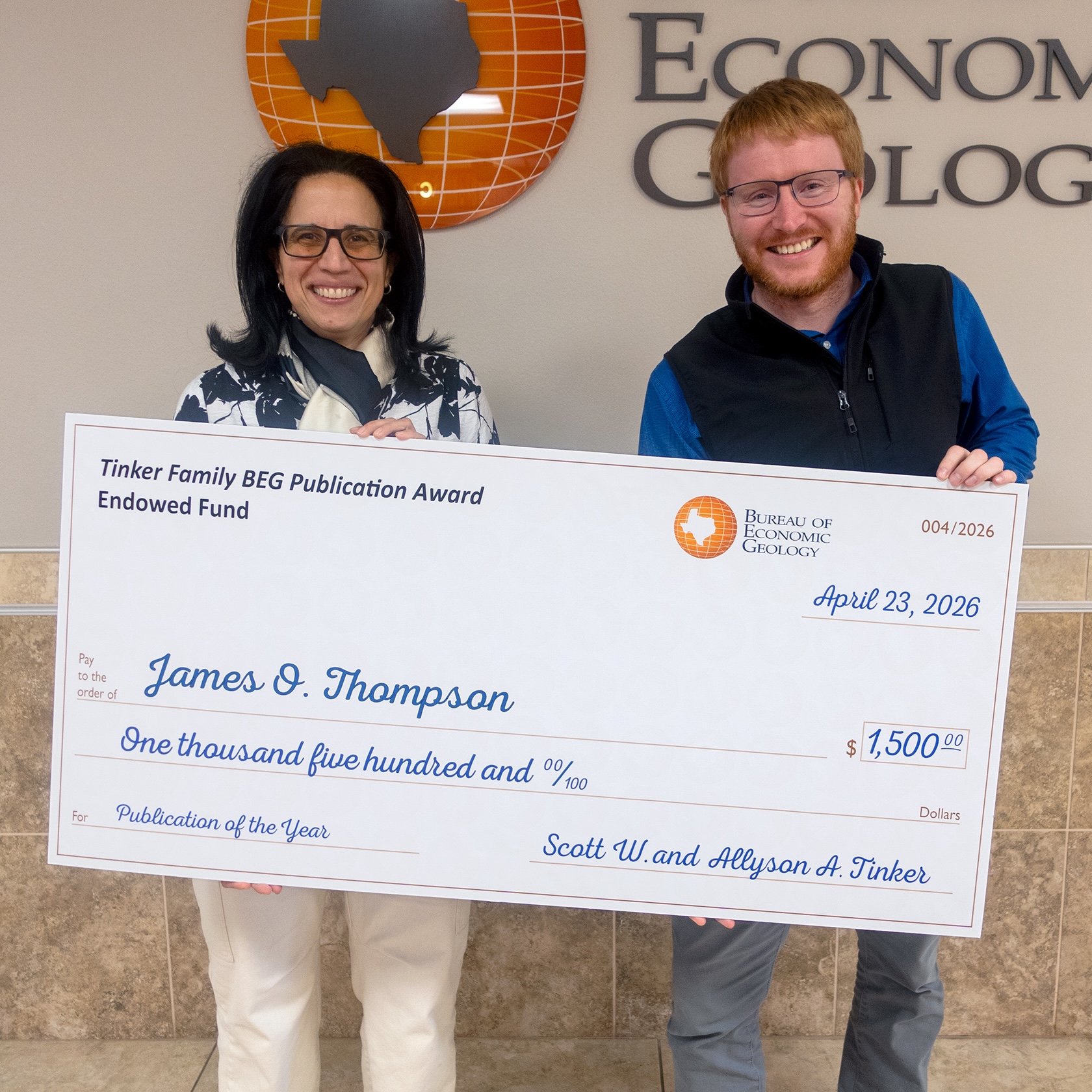 James Thompson accepts the Bureau’s 2025 Publication of the Year Award from Director Lorena Moscardelli