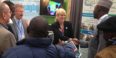 Katherine Romanak meets with climate delegates from around the world at the exhibit booth on carbon sequestration.