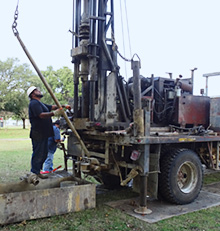 Operator taking core samples at the site of the Bureau's new Core Research Building