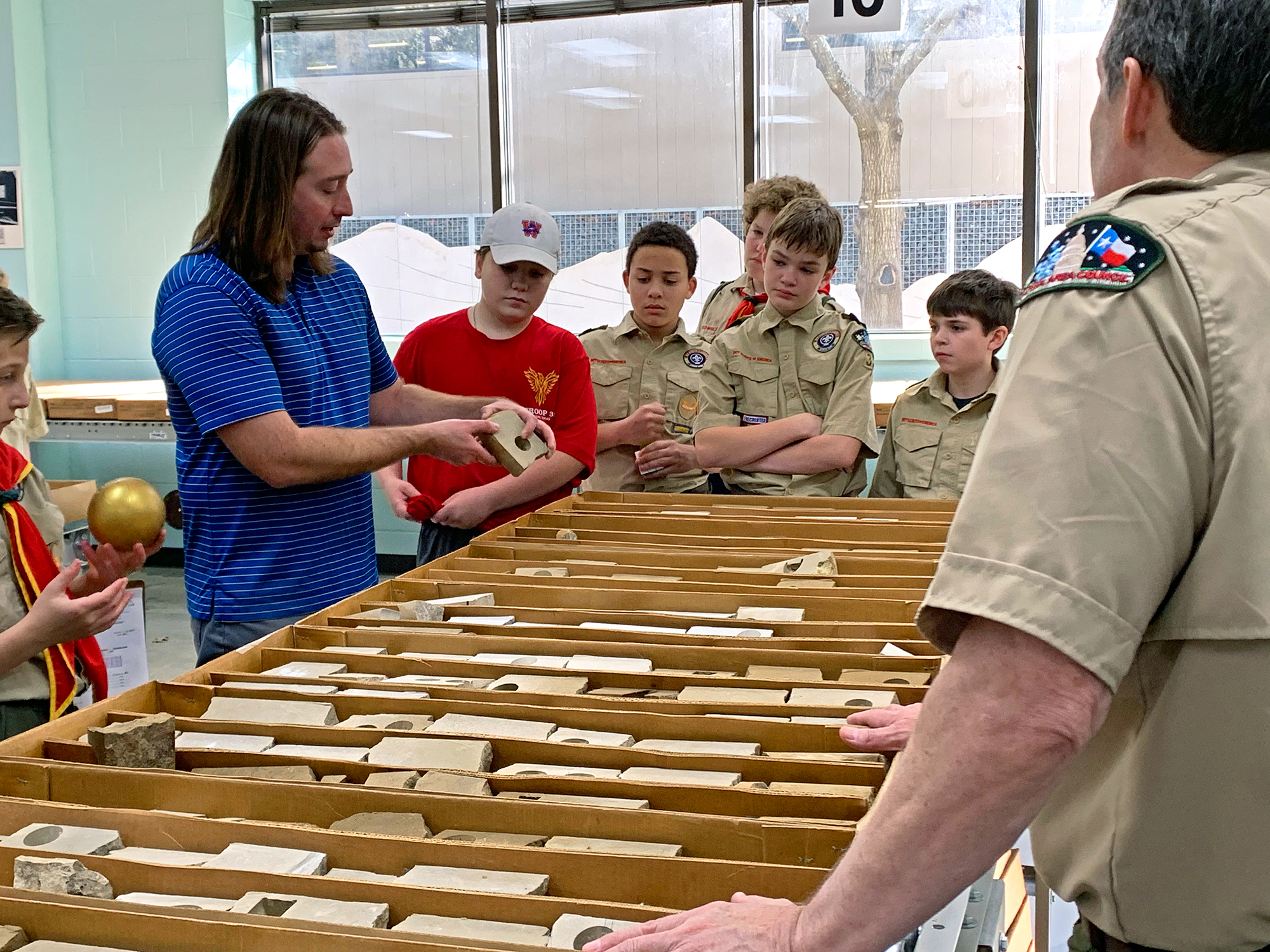 Nathan Ivicic shows the troop core samples in the Bureau’s Core Research Center.