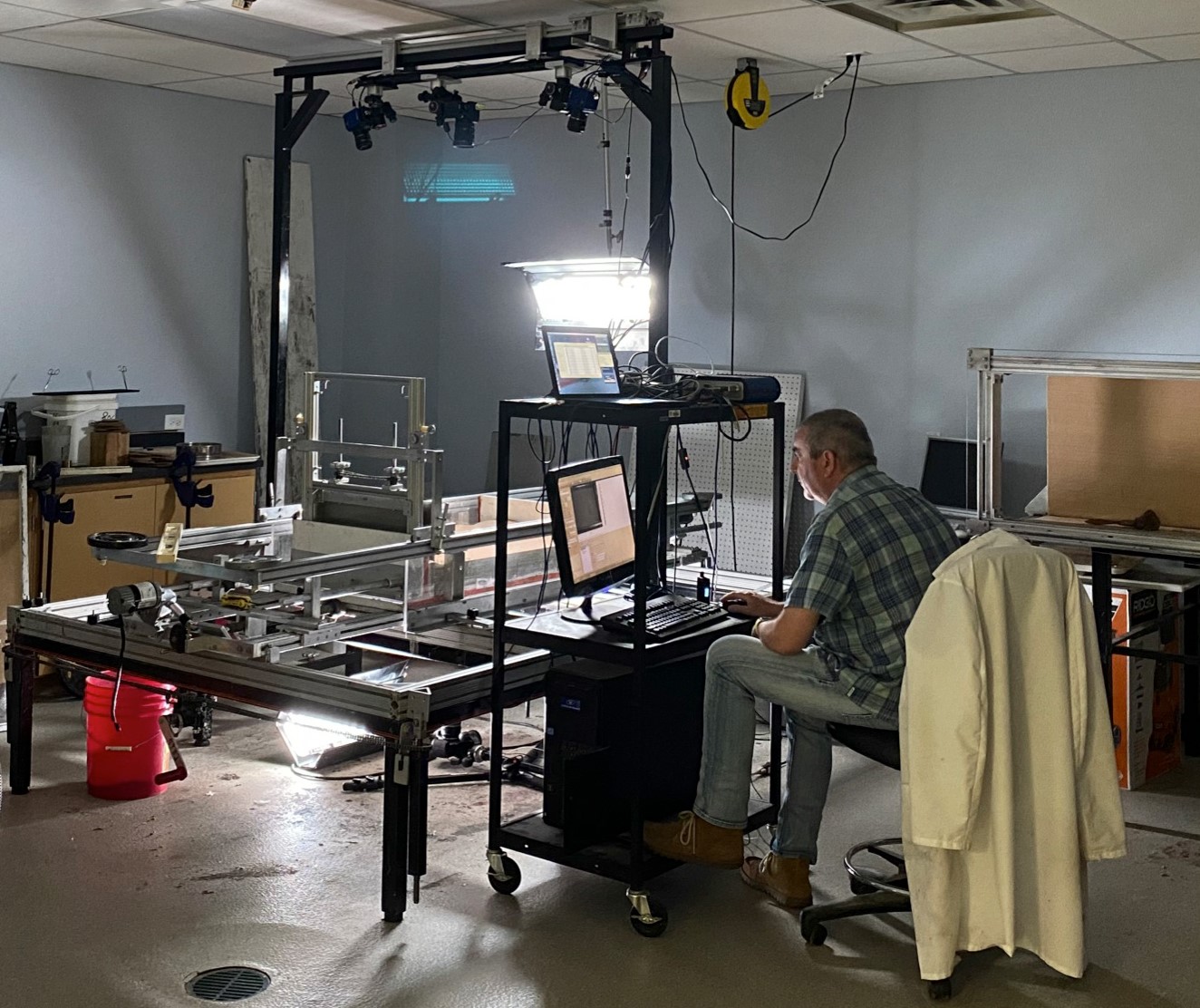 Tim Dooley completing work in the salt tectonics modeling laboratory while maintaining social distancing.