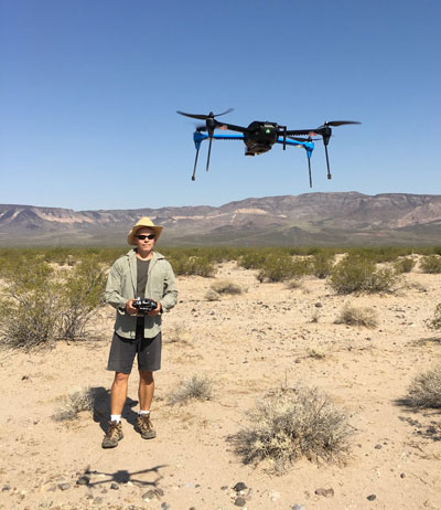 Drone flying in desert