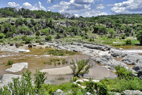 Stalactites of tufa form from waterfalls over the Cow Creek lip.